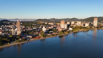 Fototapeta premium Sunrise and Sunset by the Sea – Calm Waters and Coastal Light in Brazi