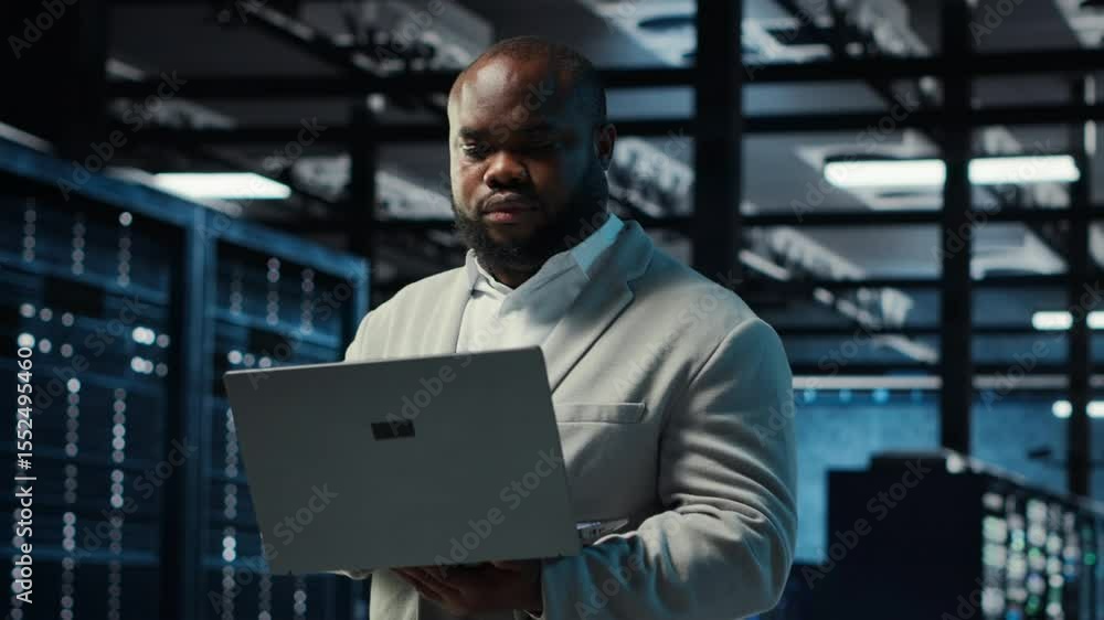 Poster data center computer scientist using laptop to manage system stability. server room it professional 