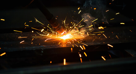 "Close-up of welding sparks and hot metal, industrial theme with dramatic lighting."

