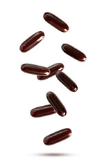 Brown supplement and vitamins falling isolated on white background.