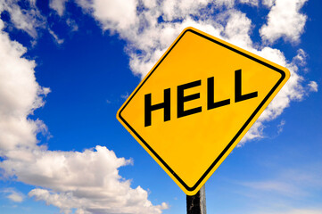 yellow road hell sign with clouds