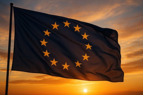 European Union flag gracefully waving against golden sunset sky creating patriotic symbol of international unity and cooperation