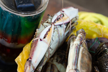 Close-up of fresh tied crabs at seafood market, crab concept