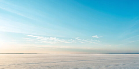 Fototapeta premium Serene Winter Landscape Vast Snowfield Under a Clear Blue Sky