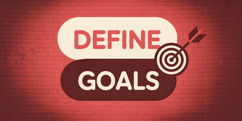 "Define Goals" text with arrow and target on red brick wall background
