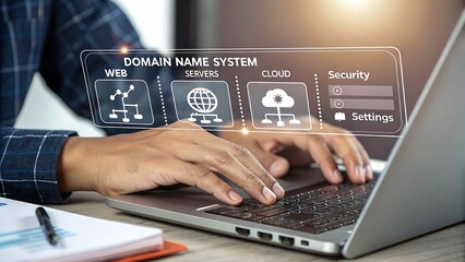 Person typing on a laptop displaying a digital interface with icons for web servers cloud computing and security settings