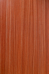 Naklejka premium Close Up Of Reddish Brown Wooden Surface Featuring Prominent Fine Vertical Grain Lines