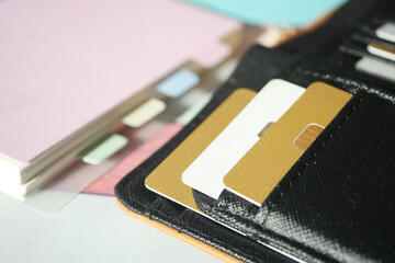 Wallet with cards and documents on a table
