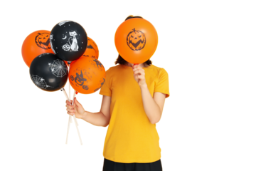 Person playfully holds Halloween balloons, isolated on white, PNG