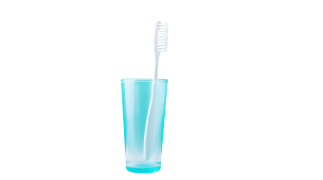 A white toothbrush standing upright inside of a light blue glass against a transparent background space for text