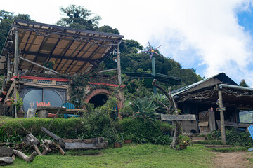 Photograph of a tourist location taken during the day with organic architectural buildings
