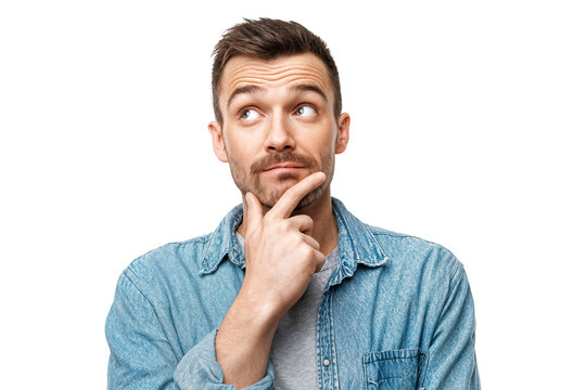 Curious man looking up while touching chin with confused and thoughtful expression isolated on transparent background