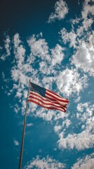 ,Wind swayes U.S. flag in the hands of a woman standing on a green wheat field4 July , USA