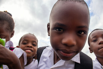 Premium close-up of happy African schoolchildren in uniforms, laughing together outdoors. A powerful and uplifting image capturing real joy, childhood, and cultural connection.