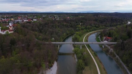 Aerial view of historic Grunwald Castle overlooking the Isar River and the surrounding Bavarian countryside. Drone footage captures the medieval ruins, the scenic landscape, and the Grunwald Bridge. 