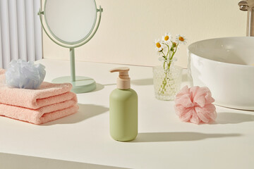 Well-lit bathroom counter with skincare items, towel and mirror. Wide surface space on right side allows ample room for product placement or custom branding overlays.