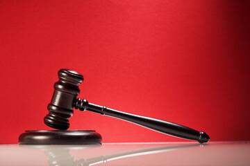 gavel hammer against red background