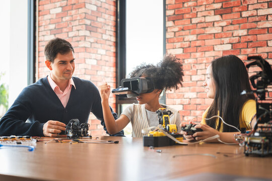 Students and Teacher Exploring Robotics and VR in STEM Class, Kids Learning with Virtual Reality and Engineering Kits, Innovative Education
