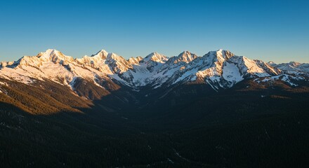 Obraz premium Majestic mountain range at sunrise