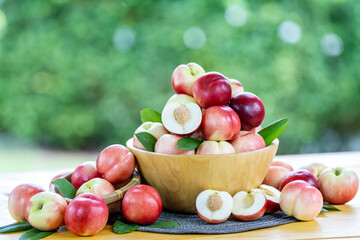 Sweet fruit, fresh Red Nectarine on a natural green background.