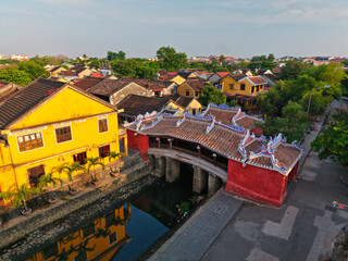 Aerial view of Chua Cau or Japanese Covered ancient Bridge and River in Old city of Hoi An, Vietnam. Vietnamese heritage and culture in Hoian ancient town