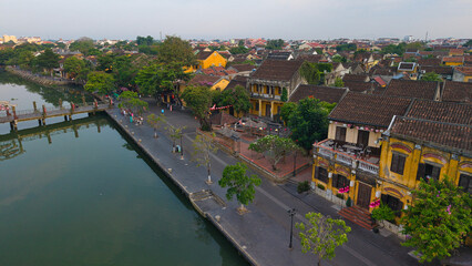 Aerial drone shot of Hoi An’s historic architecture, colorful rooftops, and traditional streets. Ideal for content related to Vietnam, Southeast Asia, heritage, and tourism