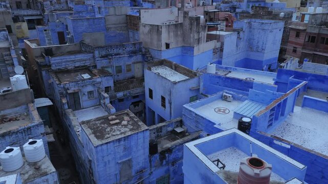 Blue buildings and residence in Jodhpur, aerial fly over.