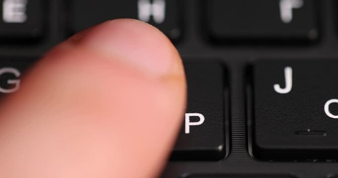 press keyboard with English and Russian letters, the black keyboard in the layout of letters in several languages, closeup