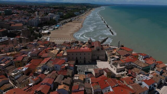 Aerial orbit around Termoli Castello Svevo and fortified coastal cliffs. Medieval old town in Italy