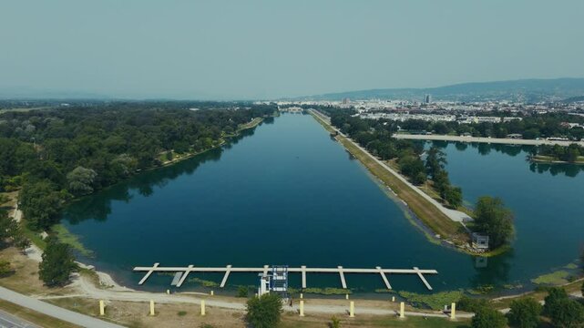 aerial view of Lake Jarun sports basin with calm water and city skyline backdrop