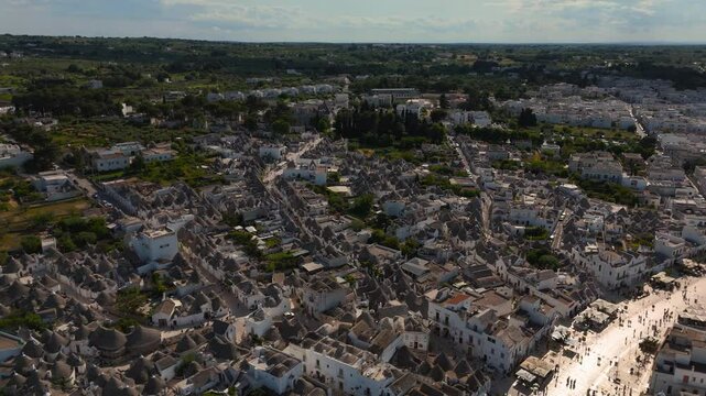 Drone view of Alberobello Trulli rooftops and narrow alleys. Round trullo shepherd huts, Apulia, Italy