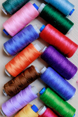 set of multi-colored spools of thread for sewing close-up