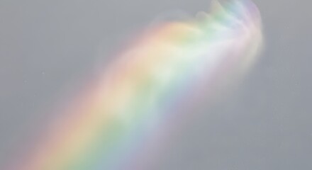 A shimmering spectrum of refracted sunshine creates a beautiful rainbow effect in the atmosphere