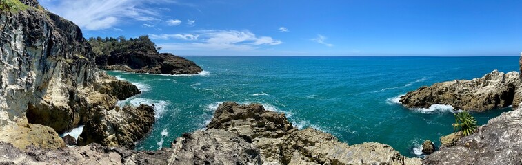 Panoramic view of Rocky Coastal Cliffs with Ocean Waves and Blue Sky &ndash; Dramatic Seascape with Natural Rock Formations