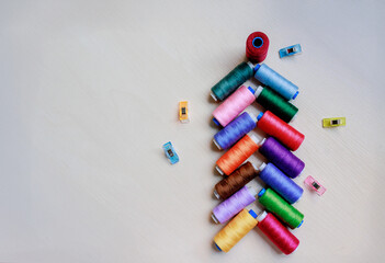 Christmas tree made of multi-colored thread spools. Christmas concept.
