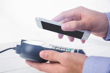 Man using smartphone to express pay