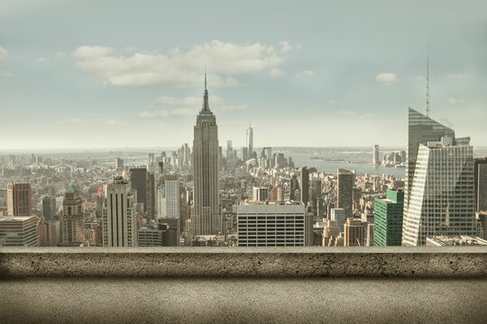 Illustrating vector rooftop ledge overlooking skyline with Empire State Building and waterfront