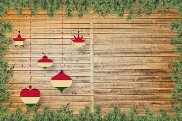 Christmas baubles in front of wood