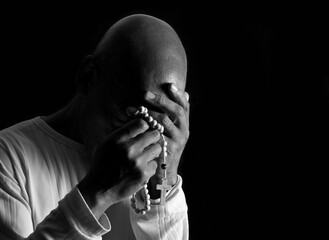 Praying to God with black background stock image stock photo