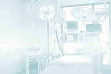 Surgical light and device screen by bed at hospital