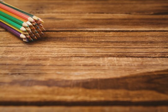 Color pencils on wooden table