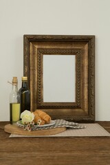 Photo frame, food and flower on table