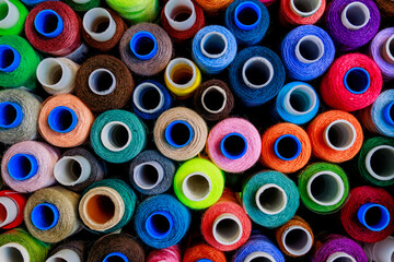 set of multi-colored spools of thread for sewing close-up