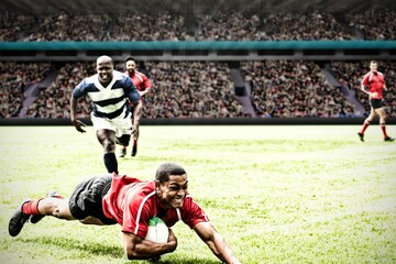Naklejka premium Rugby player jumping with the ball in sports stadium
