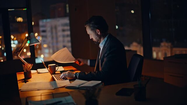 Office specialist working late dark workspace closeup. Manager taking coffee sip
