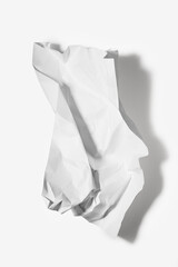 Crumpled Paper Casting Sharp Shadow on White