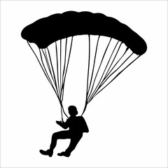 silhouette of a person parachuting