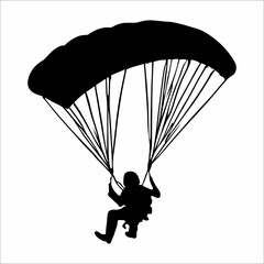 silhouette of a person parachuting