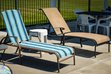 Retro pool chairs and table on deck