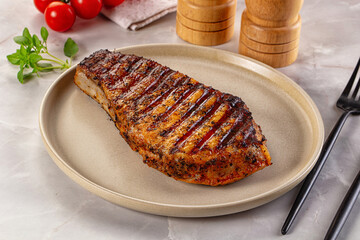 Grilled pork steak with bone